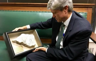 Congressman Jeff Fortenberry holds a fragment of an Iraqi Christian altar destroyed by the Islamic State. Courtesy photo
