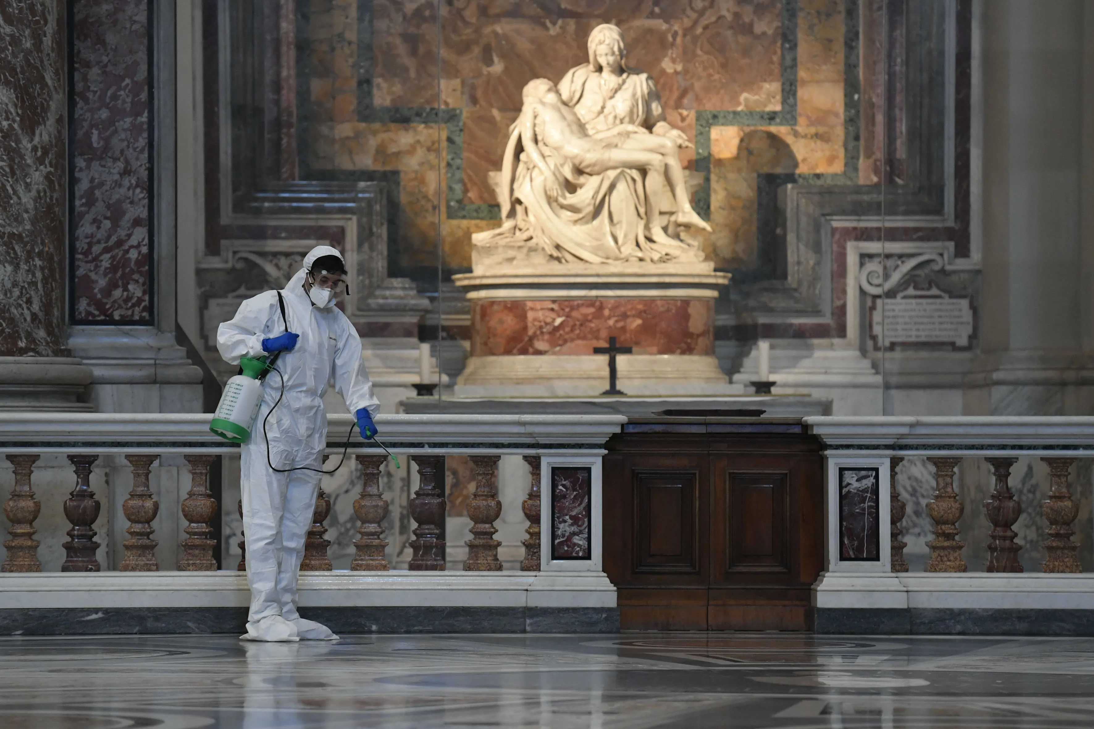 A worker cleanses St. Peter's Basilica ahead of its reopening. ?w=200&h=150