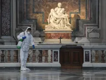 A worker cleanses St. Peter's Basilica ahead of its reopening. 