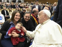 Pope Francis blesses a baby during the Saturday jubilee audience in the Vatican’s audience hall on Jan. 11, 2025.