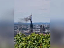 Smoke billows from the spire of Rouen Cathedral in Rouen, northern France, on July 11, 2024.