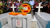 Leaders of the Christian community lay wreaths at the grave of Father Charles Joseph Young at the Holy Rosary Church cemetery in Dhaka on Nov. 14, 2025.