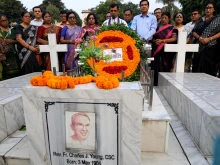 Leaders of the Christian community lay wreaths at the grave of Father Charles Joseph Young at the Holy Rosary Church cemetery in Dhaka on Nov. 14, 2025.