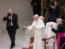 Pope Francis smiles at pilgrims during his Wednesday general audience in the Vatican's Paul VI Hall on Aug. 9, 2023.