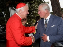 Then-Prince Charles greets archbishop of Westminster and president of the Catholic Bishops' Conference of England and Wales Cardinal Vincent Gerard Nichols during a reception for the Cardinal Newman Canonization at Pontifical Urban College on Oct. 13, 2019, at the Vatican.