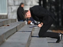 French bishops’ conference president Archbishop Éric de Moulins-Beaufort kneels in a sign of penance at Lourdes, Nov. 6, 2021.