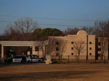 A police car sits in front of the Congregation Beth Israel Synagogue in Colleyville, Texas, some 25 miles west of Dallas, Jan. 16, 2022. - All four people taken hostage in a more than 10-hour standoff at the Texas synagogue have been freed unharmed, police said late Jan. 15, and their suspected captor is dead.