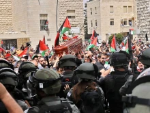 Violence erupts between Israeli security forces and Palestinian mourners carrying the coffin of slain Al-Jazeera journalist Shireen Abu Akleh out of a hospital, before being transported to a church and then her resting place, in Jerusalem, on May 13, 2022.