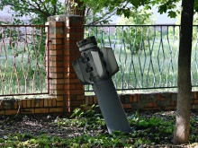A photograph taken on July 3, 2022 shows an tail section of a 300mm rocket which appear to contained cluster bombs launched from a BM-30 Smerch multiple rocket launcher embedded in the ground after shelling in Kramatorsk, amid the Russian invasion of Ukraine.