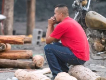 A relative of a miner is seen near the coal mine where 10 miners were trapped Wednesday, Aug. 3, 2022, after a collapse in the Agujita community, Sabinas municipality, Coahuila state, Mexico.