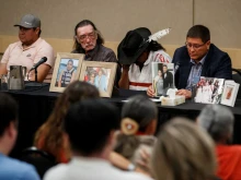 Mark Arcand (R), brother of James Smith Cree Nation stabbing victim Bonnie Burns, and Brian (2nd R), husband of Bonnie, pause behind pictures of Bonnie during a news conference in Saskatoon, Saskatchewan, Canada, Sept. 7, 2022. - One of two brothers who were the target of a massive manhunt in Canada after allegedly carrying out a stabbing spree that left 10 dead and 18 wounded has been found dead, police said on September 5. The killings in the remote James Smith Cree Nation Indigenous community and the town of Weldon in Saskatchewan province in western Canada are among the deadliest incidents of mass violence ever to hit the nation.