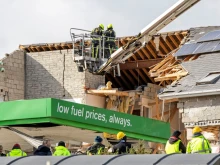 Emergency services attend the scene following an Oct. 7, 2022, explosion at a gas station and adjacent apartment building in Creeslough, County Donegal, in northwest Ireland that killed at least 10 people. Pope Francis in a letter Oct. 8, 2022, expressed his “spiritual closeness” to those affected by the tragedy.