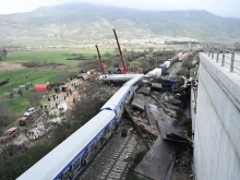 Police and emergency crews search wreckage after a train accident in the Tempi Valley near Larissa, Greece, March 1, 2023. At least 36 people were killed and another 85 injured after a collision between two trains caused a derailment near the Greek city of Larissa late at night on Feb. 28, 2023, authorities said.