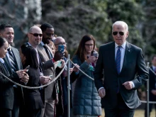 President Joe Biden, with ashes on his forehead in honor of Ash Wednesday, walks to speak to reporters before boarding Marine One with First Lady Jill Biden on the South Lawn of the White House on March 02, 2022 in Washington, DC. The Bidens are spending the day in Superior, Wisconsin, with cabinet members where they will give remarks on the bipartisan infrastructure legislation.