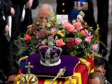 King Charles III walks alongside the coffin carrying Queen Elizabeth II with the Imperial State Crown resting on top as it departs Westminster Abbey during the State Funeral of Queen Elizabeth II on Sept. 19, 2022, in London. Elizabeth II died at Balmoral Castle in Scotland on Sept. 8, 2022, and is succeeded by her eldest son, King Charles III.