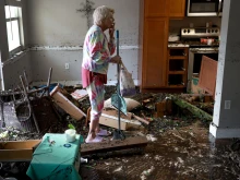 A woman looks over her apartment after floodwater inundated it when Hurricane Ian passed through the area on Sept. 29, 2022 in Fort Myers, Florida. The hurricane brought high winds, storm surge, and rain to the area, causing severe damage.