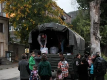 Refugees load a truck in Goris on Sept. 26, 2023, before leaving to Yerevan. A continuous stream of vehicles crept along the only road out of Nagorno-Karabakh toward Armenia, carrying tens of thousands of refugees now faced with an uncertain future.
