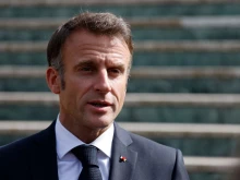 French President Emmanuel Macron talks to the press as he leaves after a European Council Informal Meeting at the Palacio de Congreso in Granada, southern Spain, on Oct. 6, 2023.