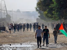 Palestinians move towards the Nahal Oz border crossing with Israel, east of Gaza City, on Oct. 7, 2023.