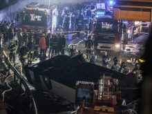 Emergency crew members work at the scene after a bus accident near Venice on Oct. 3, 2023, in Mestre, Italy.