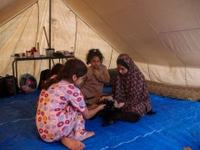 Palestinian children rest in a refugee tent along the Gaza Strip on Oct. 20, 2023, in Khan Yunis, Gaza.