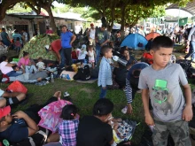 Migrants take a rest while taking part in a caravan toward the border with the United States in Tapachula, Chiapas State, Mexico, on Oct. 31, 2023.