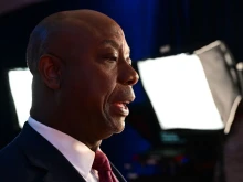 Sen. Tim Scott, R-South Carolina, speaks to members of the media in the spin room following the third Republican presidential primary debate at the Adrienne Arsht Center for the Performing Arts in Miami on Nov. 8, 2023.