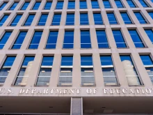 The U.S. Department of Education sign hangs over the entrance to the federal building housing the agency’s headquarters on Feb. 9, 2024, in Washington, D.C.