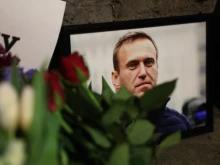 Photographs and flowers are left outside the Russian Embassy in London on Feb. 16, 2024, following the news of the death of Russian opposition leader Alexei Navalny.