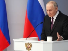 In this pool photograph distributed by Russian state agency Sputnik, Russia's President Vladimir Putin delivers his annual state of the nation address at the Gostiny Dvor conference center in central Moscow on Feb. 29, 2024.