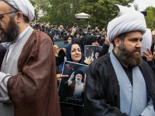 People participate in a funeral procession of president Ebrahim Raisi and his seven aides in Tabriz, East Azerbaijan province, on May 21, 2024.