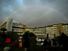 A rainbow appears above the Gemelli hospital where Pope Francis is hospitalized for tests and treatment for bronchitis in Rome on Feb. 18, 2025.