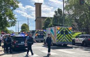 Police and first responders work at the scene of a shooting near Annunciation Church and Catholic School in Minneapolis on Aug. 27, 2025. Credit: TOM BAKER/AFP via Getty Images