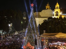 Spectators gather in Nativity Square during a Christmas tree lighting ceremony in Bethlehem on Dec. 6, 2025.