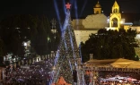 Spectators gather in Nativity Square during a Christmas tree lighting ceremony in Bethlehem on Dec. 6, 2025.