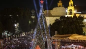 Spectators gather in Nativity Square during a Christmas tree lighting ceremony in Bethlehem on Dec. 6, 2025.