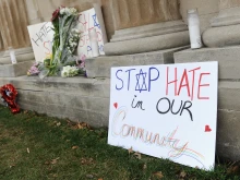 Signs are shown on display outside the Chesed Shel Emeth Cemetery on Feb. 22, 2017, in University City, Missouri, after an incident of vandalism.
