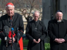 Cardinal Vincent Nichols, the Archbishop of Canterbury, Justin Welby, and Chief Rabbi Ephraim Mirvis attend a vigil in London, England, March 24, 2017.