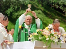 St. John Paul II during an open-air Mass on June 9, 1991, in Warsaw, Poland.