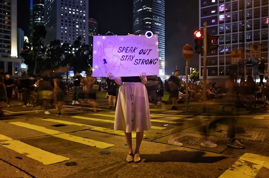 A protester holds a sign at a #MeToo rally in Hong Kong on August 28, 2019, to protest alleged sexual assaults by police. ?w=200&h=150