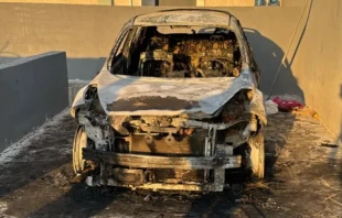 Cars were torched in an attack on the town of Taybeh in the West Bank on July 28, 2025. Credit: Photo courtesy of Palestinian Information Center