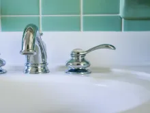 Bathroom faucet via Unsplash.