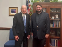 Father Guillermo Treviño Jr.’s national profile stemmed from his immigrant rights work with Escucha Mi Voz Iowa (“Hear My Voice Iowa”), a group aiding Latino workers, including immigrants. He is shown here during a meeting earlier this year with U.S. Sen.Chuck Grassley, R-Iowa.
