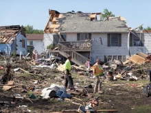Residents continue recovery and cleanup efforts on May 23, 2024, with the help of family and friends following Tuesday’s destructive tornado in Greenfield, Iowa. The storm was responsible for several deaths in the small community.