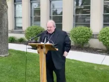 Archbishop Bernard Hebda speaks to reporters May 21. 