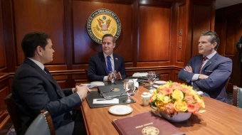 U.S. Secretary of War Pete Hegseth (at right) meets with U.S. Secretary of State Marco Rubio (at left) and then-National Security Adviser Mike Waltz (at center).