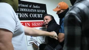 A man seeking asylum from Colombia is detained by federal agents as he attends his court hearing in immigration court at the Jacob K. Javitz Federal Building on Oct. 27, 2025, in New York City.