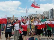 Pilgrims celebrate after hearing the news that the next World Youth Day will be hosted by Krakow, Poland in 2016. 