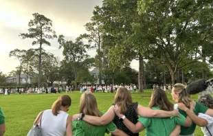 Camp Mystic alumnae sing songs after a memorial service on July 7, 2025, for the young campers who perished in floods last week. Credit: Amira Abuzeid/CNA