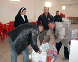 Sr. Merna overseeing distribution of aid to poor. (ACN file photo Sept. 2008) ?w=200&h=150